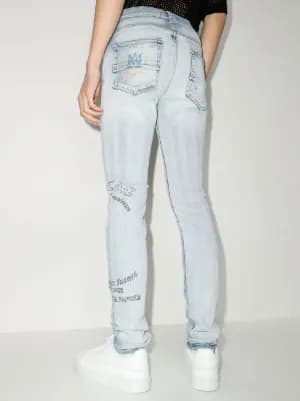 x Zig Zag motif-print skinny jeans by AMIRI