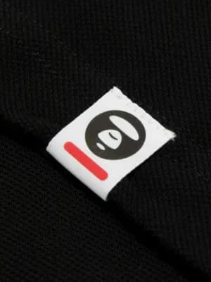 Moonface logo-patch polo shirt 8