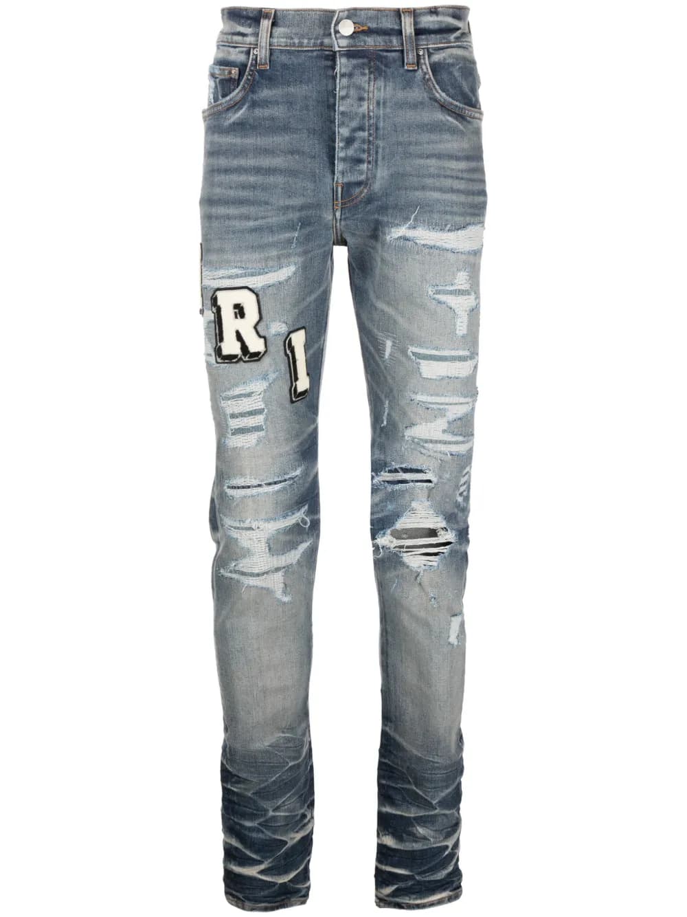 Varsity ripped skinny jeans by AMIRI